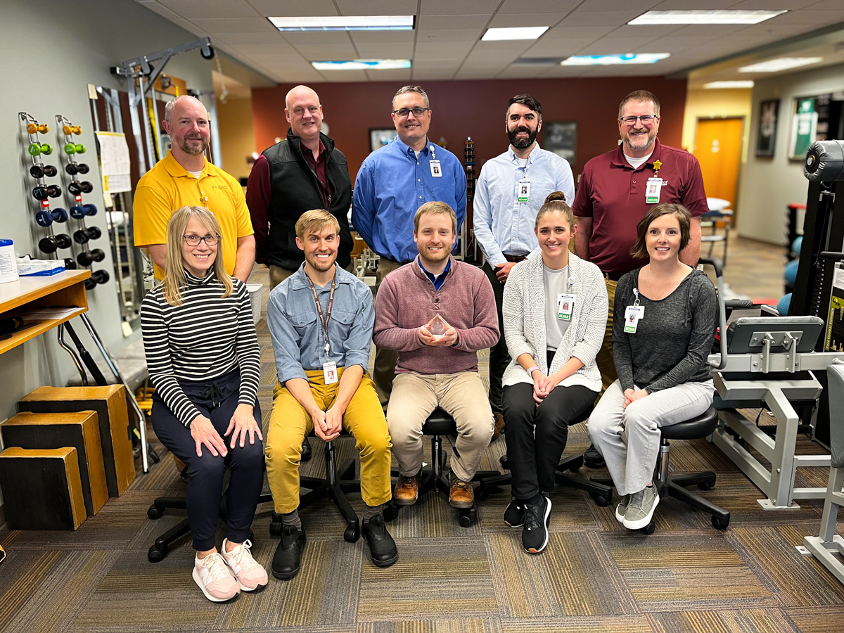 Grand Itasca's multidisciplinary team posing for a photo with the partners with distinction award.